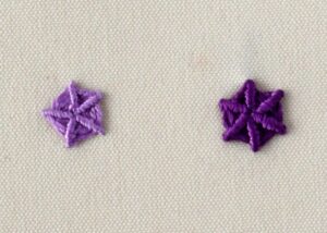 Whipped spider wheel embroidery with purple threads